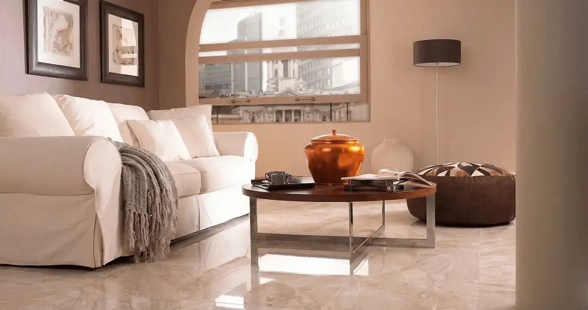 Modern living room with professionally installed marble flooring, a beige sofa, coffee table in Providence, RI