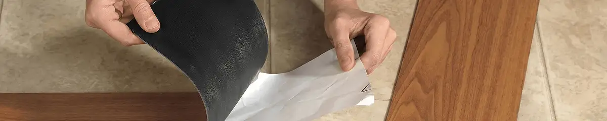A professional installing vinyl flooring in Providence, RI